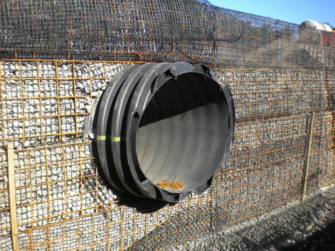 Design of pipe penetration through GRS wall.