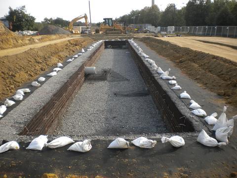 Placement of soil layers above stormwater detention system.