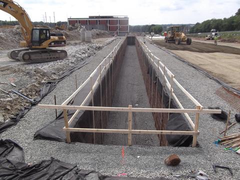 Temporary guide rail installed for safety at deep stormwater job.