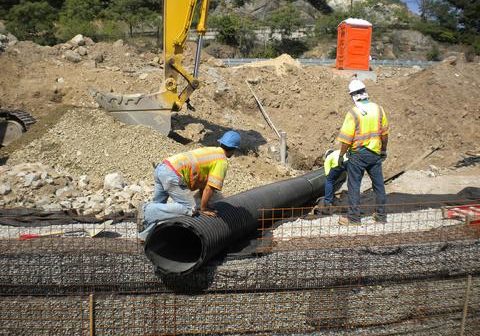 Positioning stormwater inlet pipe.